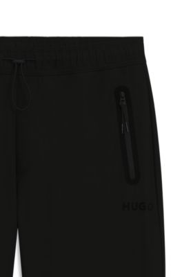 Pantalones regular fit de tejido de sarga con el&aacute;stico, Negro