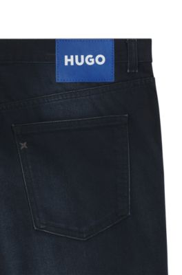 Jeans tapered fit de denim el&aacute;stico azul-negro, Azul oscuro
