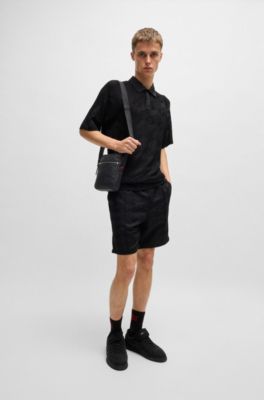 Faux-leather reporter bag with stacked and geometric logos, Black