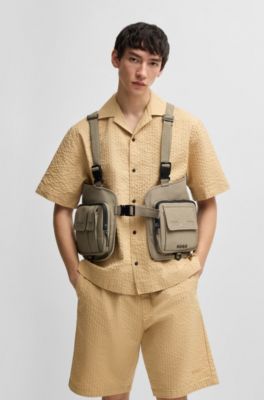 Vest-style backpack with multiple pockets, Brown