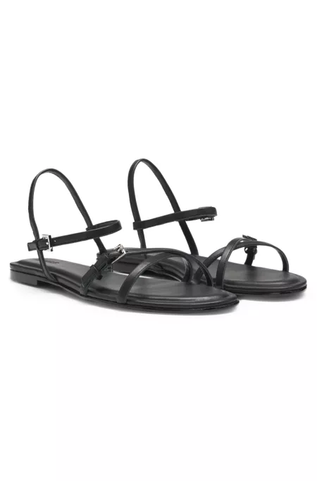 Flat sandals in nappa leather with logo buckles