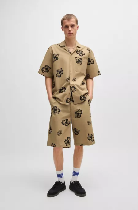 Baggy-fit shorts in hibiscus-print stretch-cotton twill