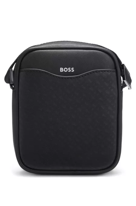 Reporter bag with monogram-patterned front pocket