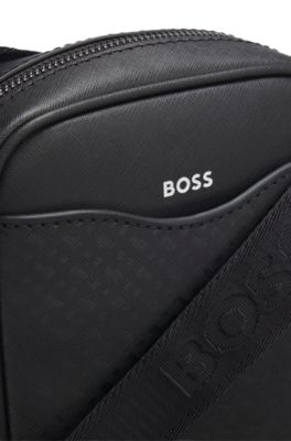 BOSS - Reporter bag with monogram-patterned front pocket - Black
