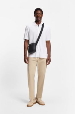 Reporter bag with monogram-patterned front pocket, Black