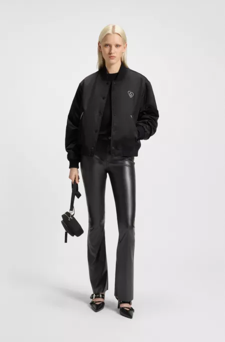 Flared trousers in faux leather