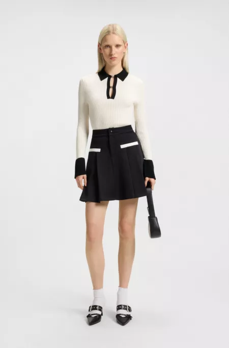 Knit sweater with stacked-logo placket links