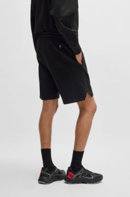 Shorts HUGO x RB en felpa de algod&oacute;n con logo en carbono sutil, Negro