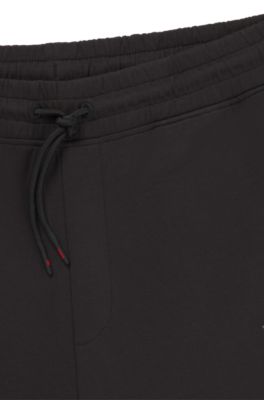 Pantalones de ch&aacute;ndal de mezcla de algod&oacute;n HUGO x RB con detalles de ribetes, Negro