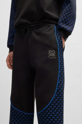 Pantalones de ch&aacute;ndal de mezcla de algod&oacute;n HUGO x RB con detalles de ribetes, Negro