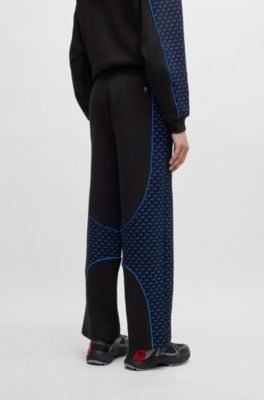 Pantalones de ch&aacute;ndal de mezcla de algod&oacute;n HUGO x RB con detalles de ribetes, Negro