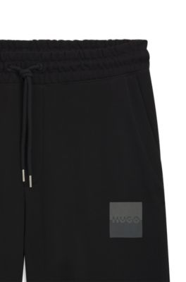 Pantalones de ch&aacute;ndal en felpa de algod&oacute;n con logo dividido, Negro