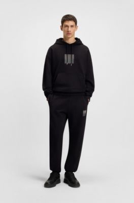Split-logo tracksuit bottoms in cotton terry, Black
