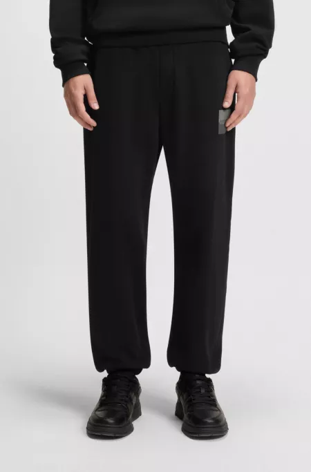 Split-logo tracksuit bottoms in cotton terry