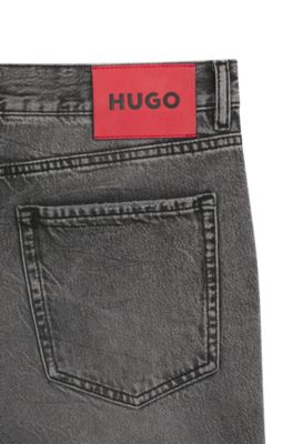 Jean Tapered en denim rigide &agrave; effets us&eacute;s, Gris