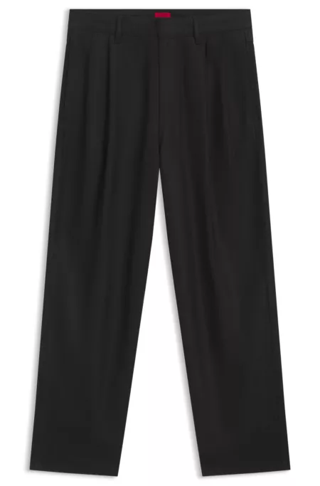 Black relaxed-fit jeans in waxed denim