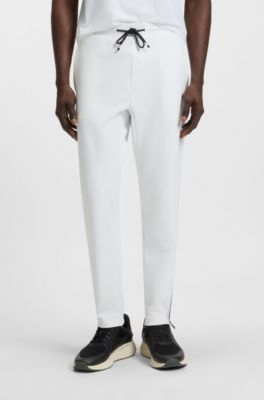 Pantalones de ch&aacute;ndal en tejido de gabardina el&aacute;stica activa con tecnolog&iacute;a de termorregulaci&oacute;n, Blanco