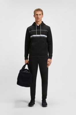 Pantalones de ch&aacute;ndal de algod&oacute;n con detalles de rayas, Negro