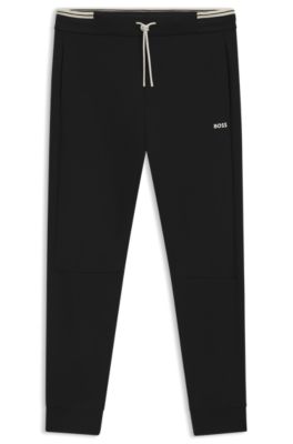 Pantalones de ch&aacute;ndal de algod&oacute;n con detalles de rayas, Negro