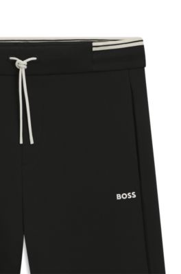 Pantalones de ch&aacute;ndal de algod&oacute;n con detalles de rayas, Negro
