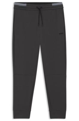 Pantalones de ch&aacute;ndal de algod&oacute;n con detalles de rayas, Gris oscuro