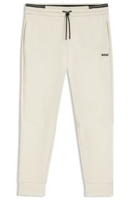 Pantalones de ch&aacute;ndal de algod&oacute;n con detalles de rayas, Blanco