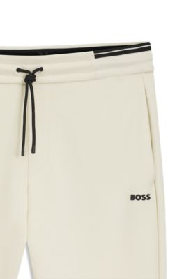 Pantalones de ch&aacute;ndal de algod&oacute;n con detalles de rayas, Blanco