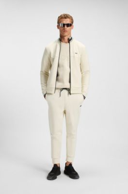 Pantalones de ch&aacute;ndal de algod&oacute;n con detalles de rayas, Blanco
