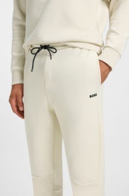 Pantalones de ch&aacute;ndal de algod&oacute;n con detalles de rayas, Blanco