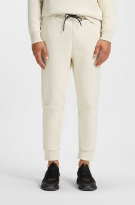 Pantalones de ch&aacute;ndal de algod&oacute;n con detalles de rayas, Blanco