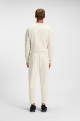 Pantalones de ch&aacute;ndal de algod&oacute;n con detalles de rayas, Blanco
