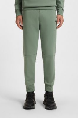 Stripe-detail tracksuit bottoms in a cotton blend, Light Green