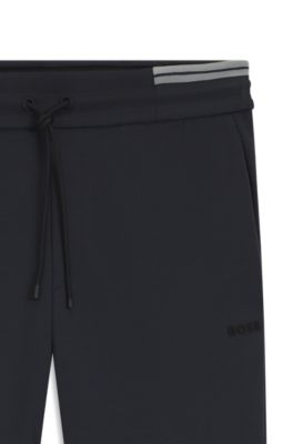 Stripe-detail tracksuit bottoms in a cotton blend, Dark Blue