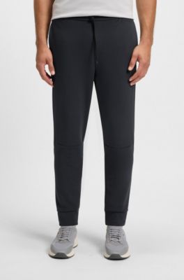 Pantalones de ch&aacute;ndal de algod&oacute;n con detalles de rayas, Azul oscuro