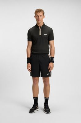 Camiseta deportiva con cremallera en el cuello en punto de malla el&aacute;stica, Negro