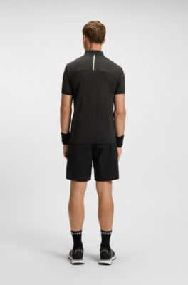 Camiseta deportiva con cremallera en el cuello en punto de malla el&aacute;stica, Negro