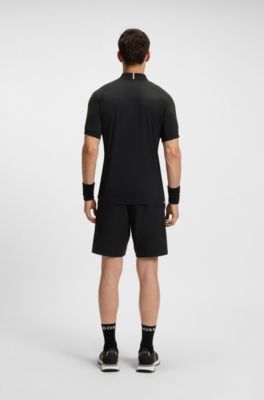 Polo slim fit de secado r&aacute;pido en tejido antidesgarros el&aacute;stico, Negro