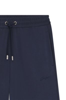 Pantalones de ch&aacute;ndal relaxed fit con logo bordado, Azul oscuro