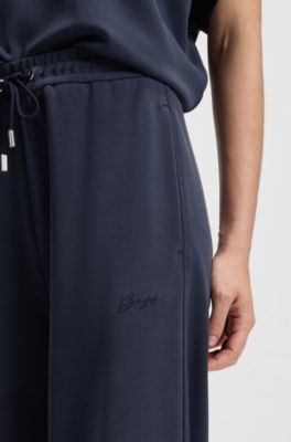 Pantalones de ch&aacute;ndal relaxed fit con logo bordado, Azul oscuro