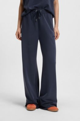 Pantalones de ch&aacute;ndal relaxed fit con logo bordado, Azul oscuro