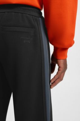 Porsche x BOSS tracksuit bottoms with side stripes, Black