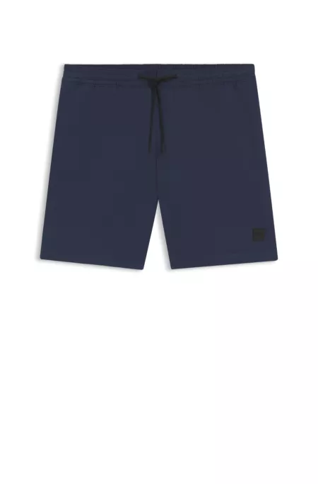 Logo-badge swim shorts with packable construction