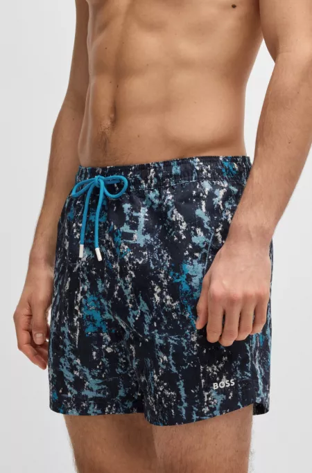 Quick-dry swim shorts with all-over print