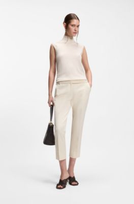 Sleeveless top in merino wool with mock neck, White