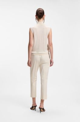 Sleeveless top in merino wool with mock neck, White