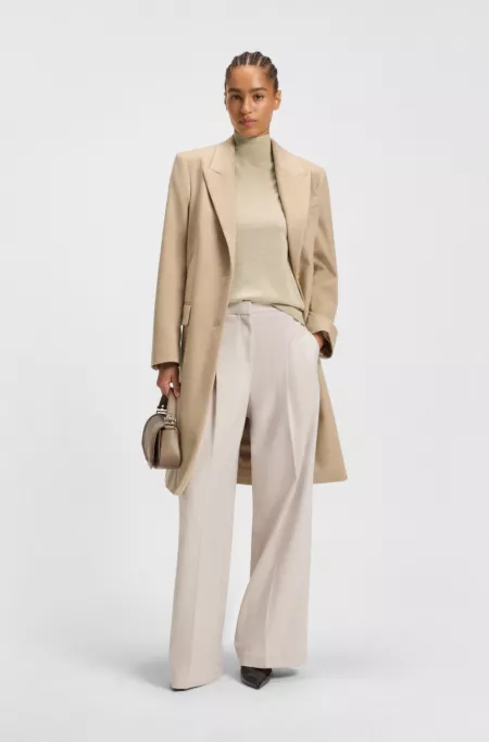 Sleeveless top in merino wool with mock neck