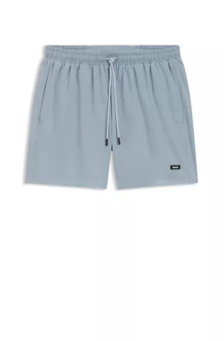 Swim shorts with rubber logo badge