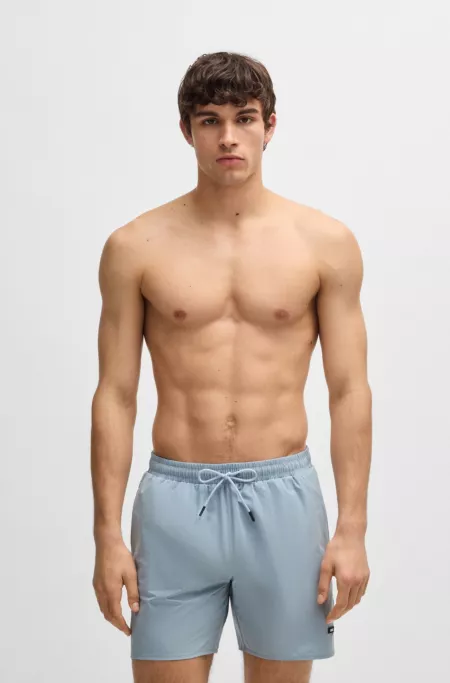 Swim shorts with rubber logo badge