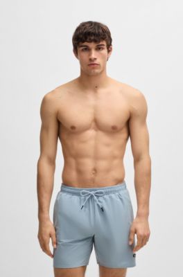 Ba&ntilde;ador con insignia de logo de goma, Celeste