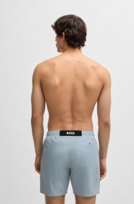 Ba&ntilde;ador con insignia de logo de goma, Celeste